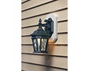 outdoor sconce mounted on side of house