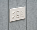 receptacle mounted flush with wall by using a box extender