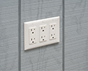 receptacle mounted flush with wall by using a box extender