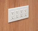 receptacle mounted flush with wall by using a box extender