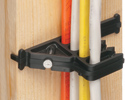 cable spacer attached to wooden stud and securing four non metallic cables