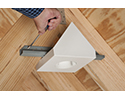 person tightening ceiling box bracket with screwdriver
