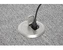 floor box in carpeted floor with device plugged into receptacle