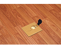 floor box in wooden floor with flip lid open