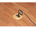 floor box in wooden floor with device plugged in