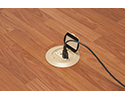 floor box in wooden floor with device plugged in