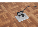 floor box in wooden floor with device plugged in