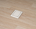 floor box in wooden floor with blank cover