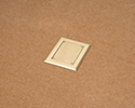 floor box in tiled floor with blank cover