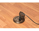 floor box in wooden floor with device plugged in