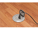 floor box in wooden floor with device plugged in