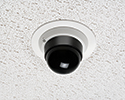 security camera mounted on ceiling tile