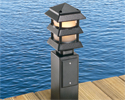 garden post with lamp mounted to dock overlooking lake