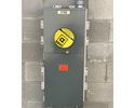 multiple meter mounting bases mounted on concrete block wall with large meter installed