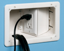 recessed TV box mounted in wall with power and low voltage devices plugged in
