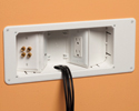 recessed TV box mounted in wall with low voltage cables run through box