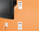 bridge kit in wall, upper box hidden by TV, lower box plugged in to outlet