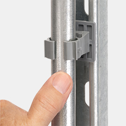 QuickLATCH mounted to beam while a metal conduit is being installed