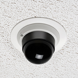 Dome security camera mounted to ceiling