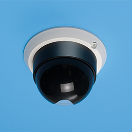 Dome security camera mounted onto ceiling
