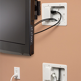 Low profile TV bridge kit consisting of two two gang boxes installed behind a TV
